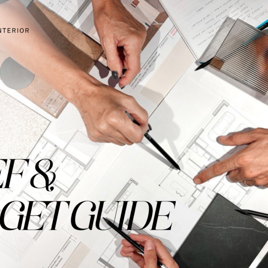 Interior designers meeting to review architectural floor plans, material samples, and budget guides for a client project.